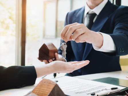 Realtor hands over keys to homeowner