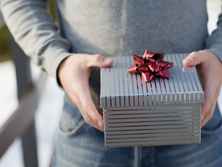 Man holds a gift in his hand